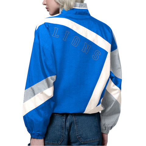 Person wearing a blue and gray 'LIONS' jacket on a white background